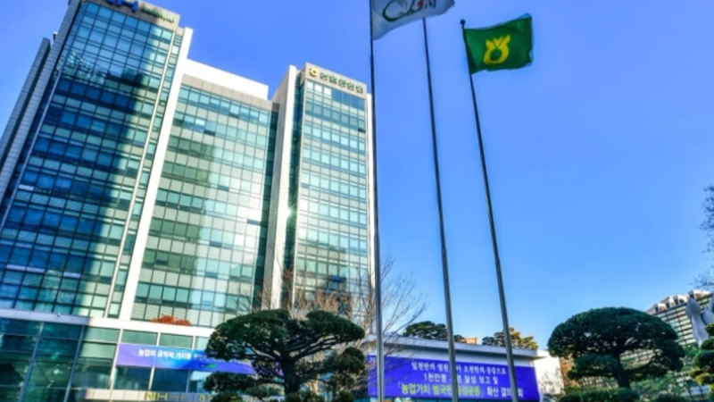 A conceptual 3D render showing the Nonghyup (NACF) logo integrated with a digital South Korean Won (KRW) stablecoin token, representing the digital transformation of Korean agricultural finance.