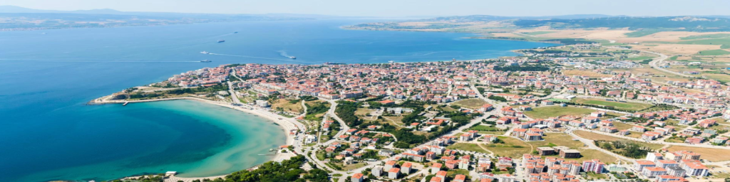Architectural rendering of modern coastal luxury estates along the Dardanelles Strait in Troy with digital blockchain network overlay graphics.