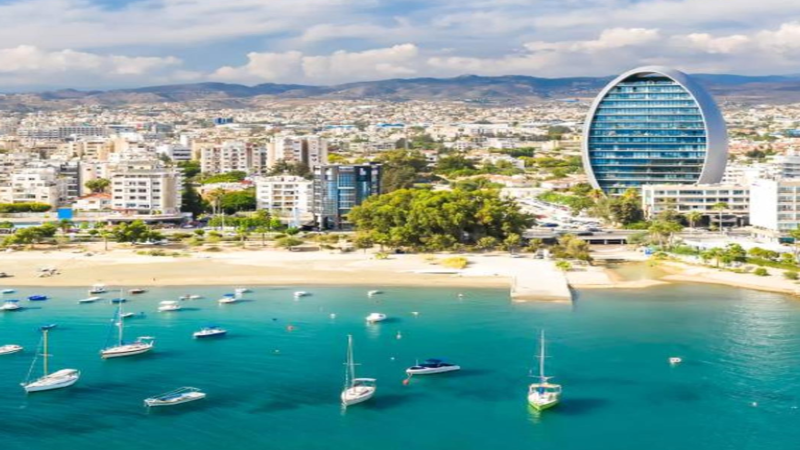 Architectural view of Limassol Marina luxury coastal skyline with digital blockchain overlay graphics.