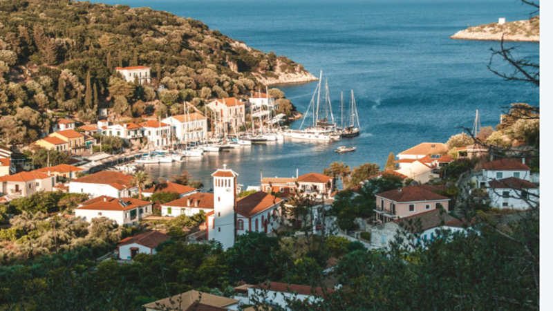 Architectural rendering of luxury cliffside villas and yachts anchored in Vathy Harbor, Ithaca, with digital blockchain network overlay graphics.