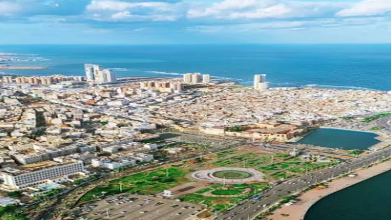 A highly secure, modernized logistics compound in Tripoli, Libya, juxtaposed with digital blockchain security layers and offshore ADGM legal structure icons.