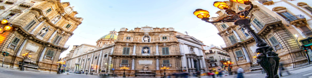 "The Quattro Canti is therefore much more than just a magnificent crossroads in the center of Palermo; it is the soul of the city, carved in stone and filled with the unmistakable Sicilian life. Here, where the main arteries of the old town meet, centuries of Spanish splendor and baroque theatricality merge with the pulsating rhythm of modern everyday life."/credit: italien-news