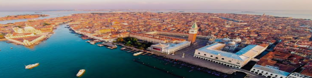 Venice[a] is a coastal city in northeastern Italy and the capital of the region of Veneto. It is built on a group of 126 islands that are separated by expanses of open water and by canals; portions of the city are linked by 472 bridges./credit: wikipedia